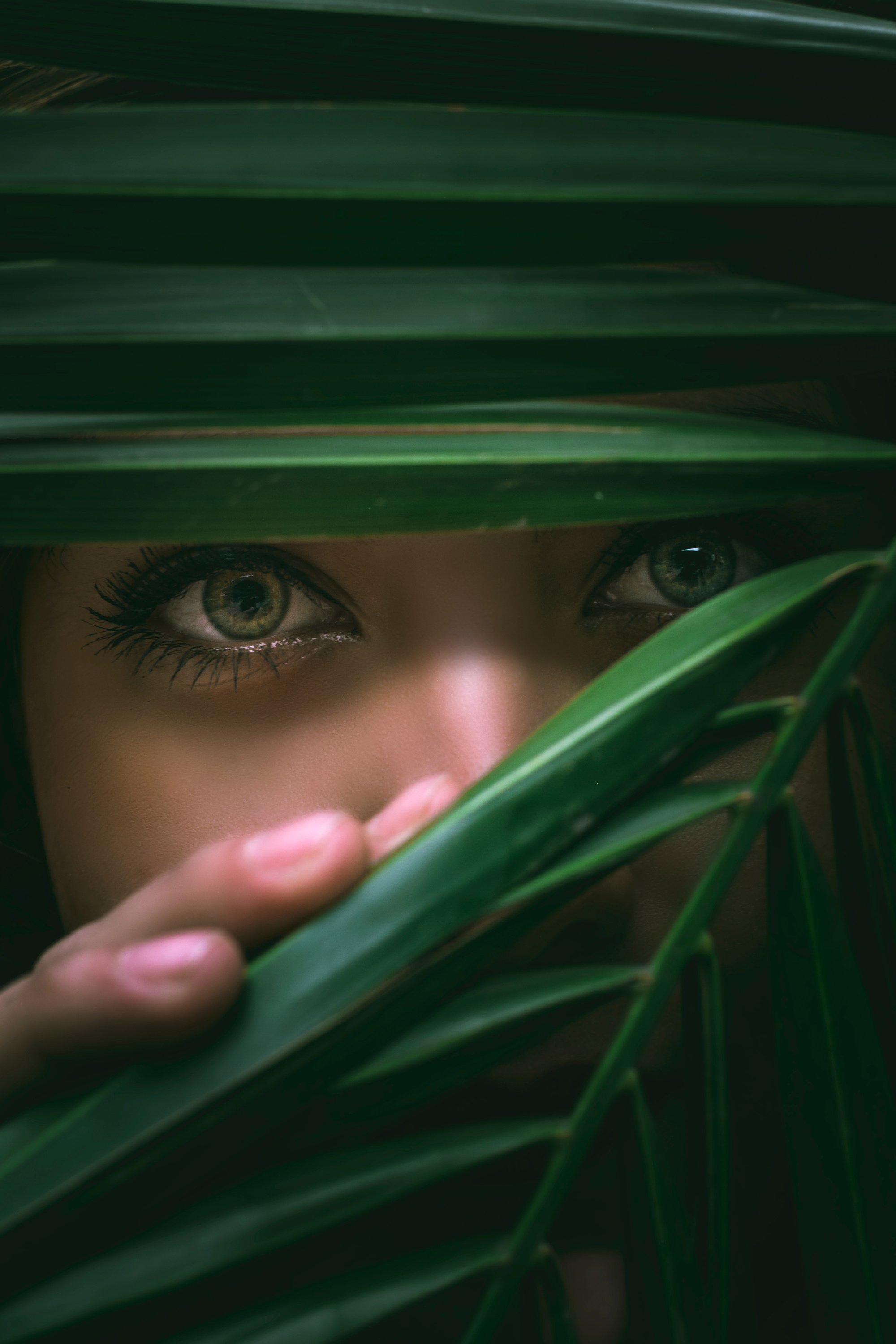 Woman Hiding Behind Leaves